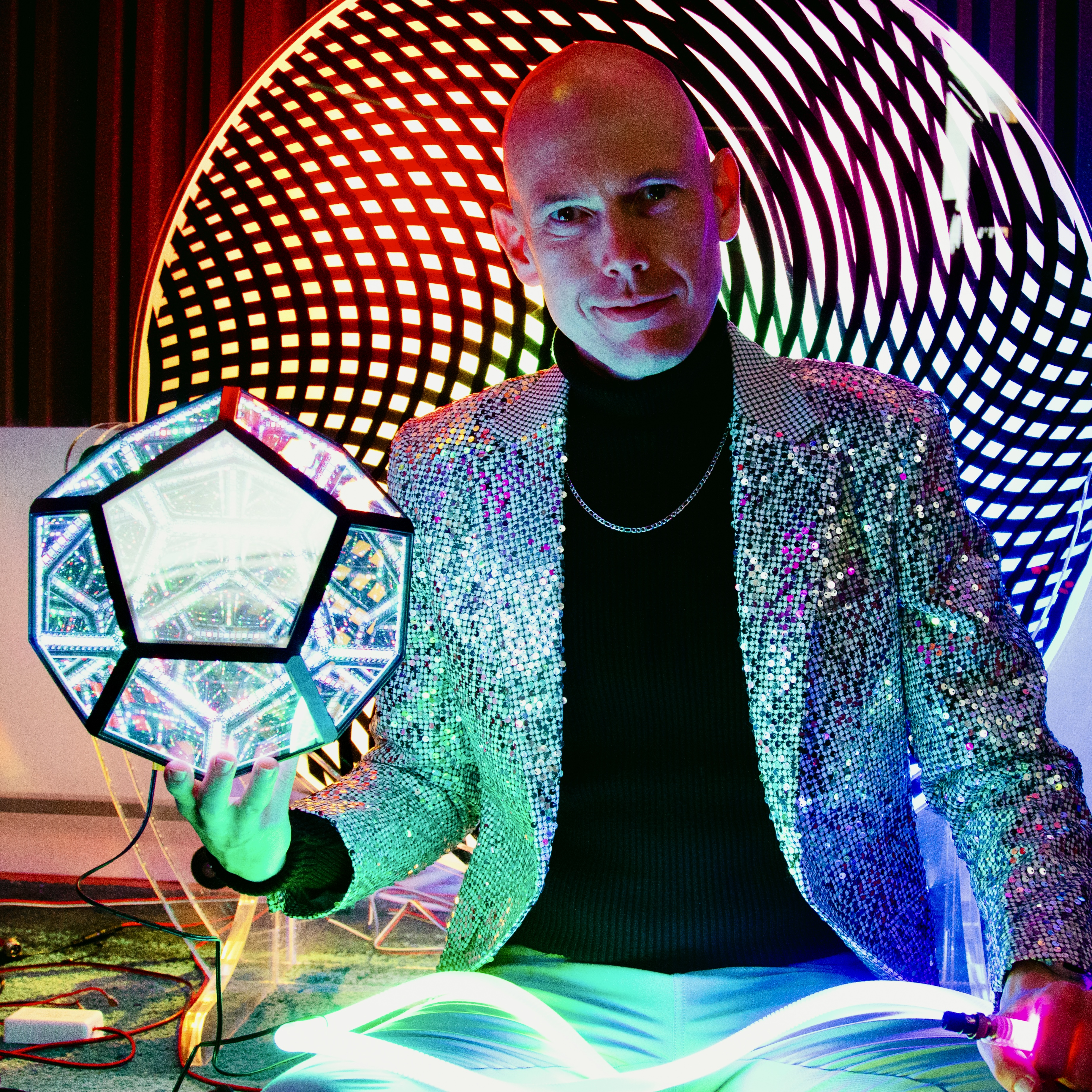 Jacob Buys in his studio with selected light art